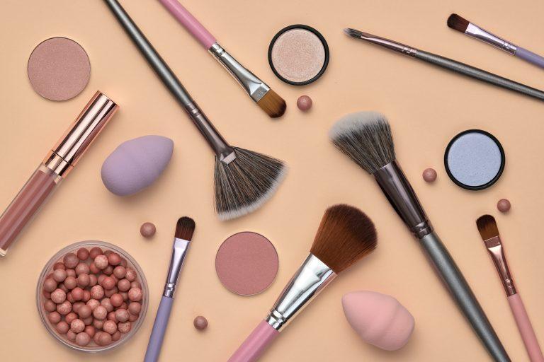 Fashion beauty product fall layout. Woman Essentials cosmetic makeup autumn Set. Collection beauty accessories. Trendy Brushes, lipstick, accessories art Flat lay. Creative make up shopping concept