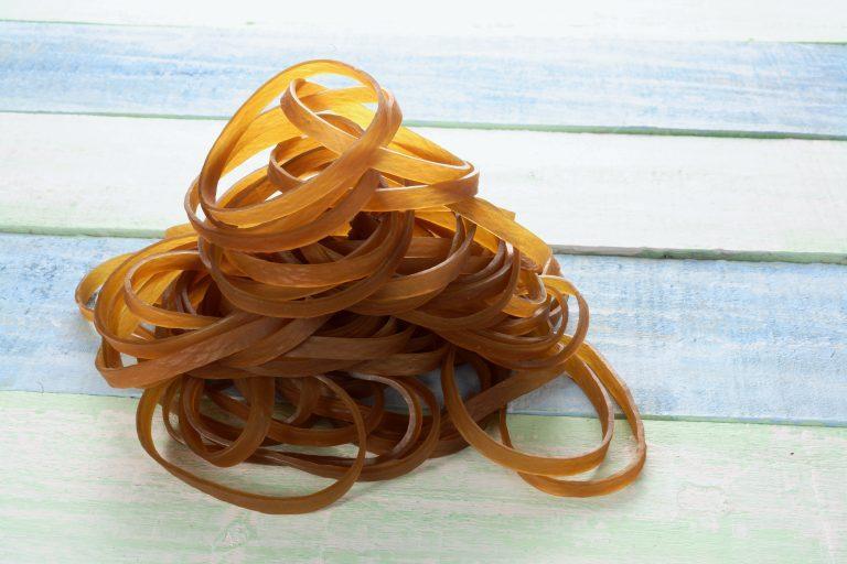 Rubber Bands on Wooden Background